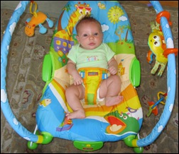 Baby in Tiny Love Gymini Bouncer